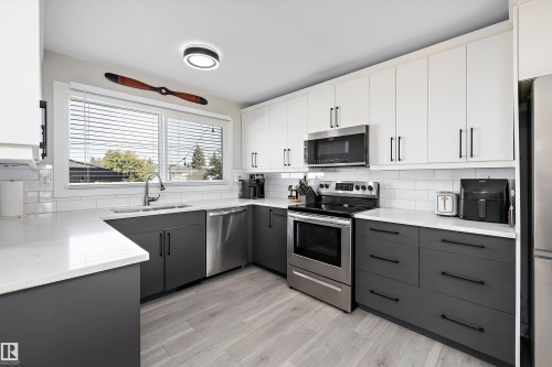6304 94A Avenue, Edmonton, AB - Indoor Photo Showing Kitchen With Double Sink