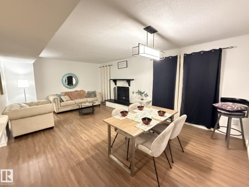 5344 38A Avenue, Edmonton, AB - Indoor Photo Showing Living Room With Fireplace