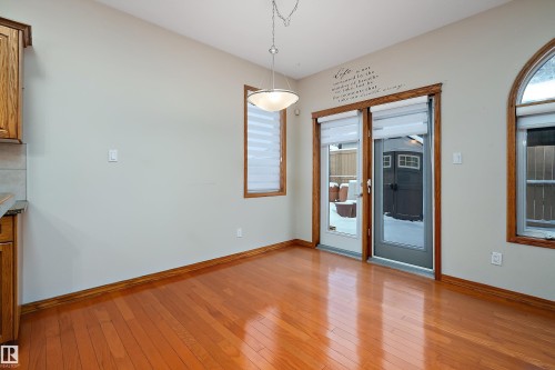 Unfurnished dining area with light wood-style floors and baseboards - 4931 48 Avenue, Onoway, AB - Indoor Photo Showing Other Room