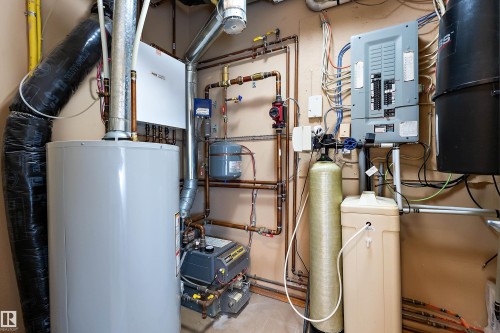 Utility room featuring electric panel and gas water heater - 4931 48 Avenue, Onoway, AB - Indoor Photo Showing Basement