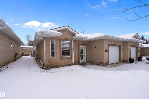 Ranch-style house with stucco siding and an attached garage - 4931 48 Avenue, Onoway, AB - Outdoor