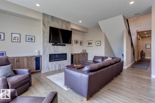 19 20425 93 Avenue, Edmonton, AB - Indoor Photo Showing Living Room With Fireplace