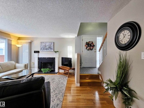 10 35 Garden Road, St. Albert, AB - Indoor Photo Showing Living Room With Fireplace