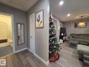 Living area with wood finished floors and recessed lighting - 12410 120 Avenue, Edmonton, AB  - Indoor 