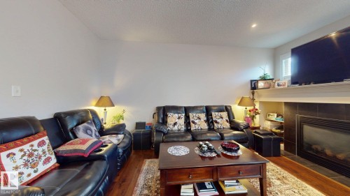 2917 16 A Avenue, Edmonton, AB - Indoor Photo Showing Living Room With Fireplace