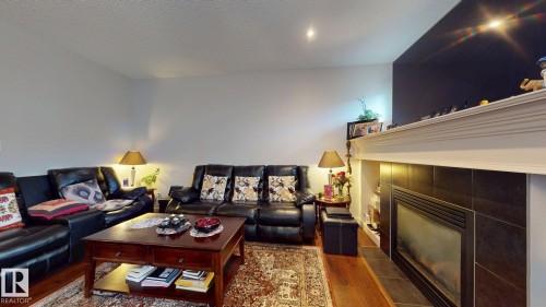 2917 16 A Avenue, Edmonton, AB - Indoor Photo Showing Living Room With Fireplace