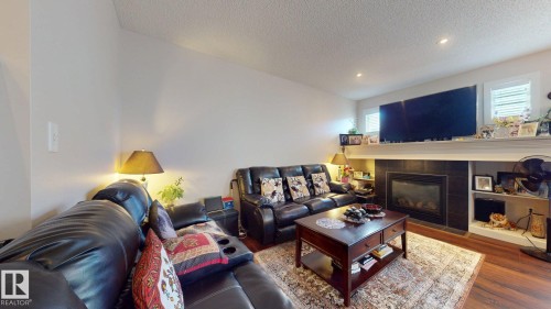 2917 16 A Avenue, Edmonton, AB - Indoor Photo Showing Living Room With Fireplace