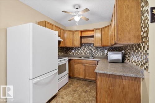 15621 83A Street, Edmonton, AB - Indoor Photo Showing Kitchen With Double Sink