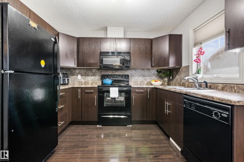 64 2336 Aspen Trail, Sherwood Park, AB - Indoor Photo Showing Kitchen With Double Sink