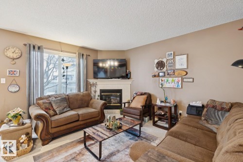 5 4020 21 Street, Edmonton, AB - Indoor Photo Showing Living Room With Fireplace