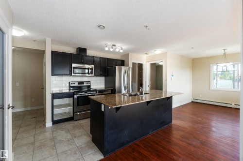 214 12660 142 Avenue, Edmonton, AB - Indoor Photo Showing Kitchen With Stainless Steel Kitchen With Double Sink With Upgraded Kitchen