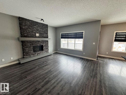 1352 Secord Landing Landing, Edmonton, AB - Indoor Photo Showing Living Room With Fireplace