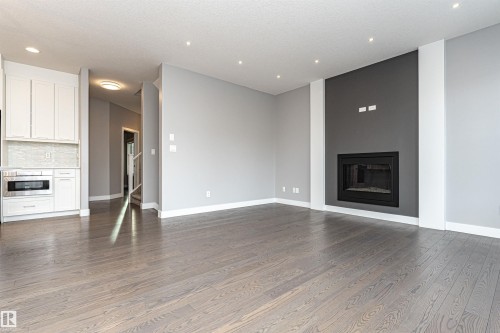 3611 Keswick Boulevard, Edmonton, AB - Indoor Photo Showing Living Room With Fireplace