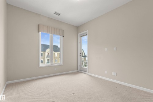 425 6083 Maynard Way E, Edmonton, AB - Indoor Photo Showing Other Room