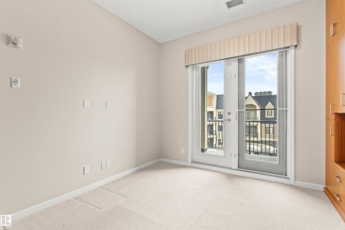 425 6083 Maynard Way E, Edmonton, AB - Indoor Photo Showing Other Room