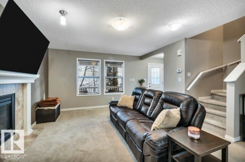 1512 70 Street Sw, Edmonton, AB - Indoor Photo Showing Living Room With Fireplace