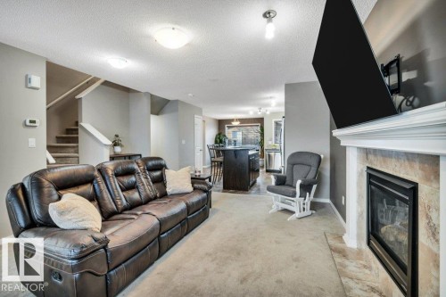 1512 70 Street Sw, Edmonton, AB - Indoor Photo Showing Living Room With Fireplace