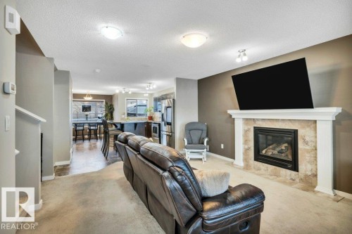 1512 70 Street Sw, Edmonton, AB - Indoor Photo Showing Living Room With Fireplace