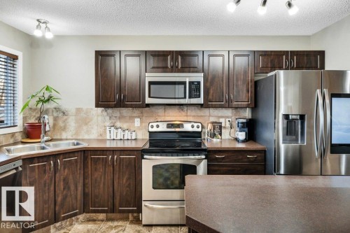 1512 70 Street Sw, Edmonton, AB - Indoor Photo Showing Kitchen With Double Sink