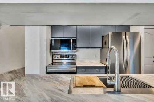 134 17447 98A Avenue, Edmonton, AB - Indoor Photo Showing Kitchen With Double Sink