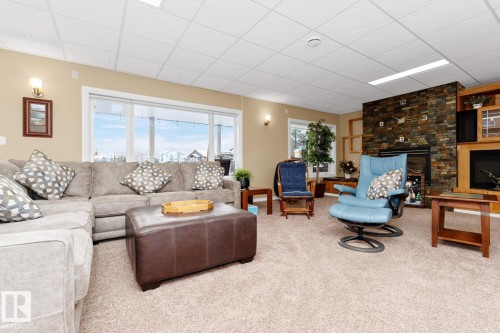 3211 62 Street, Beaumont, AB - Indoor Photo Showing Living Room With Fireplace