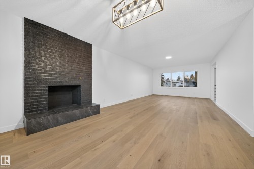 11147 36A Avenue, Edmonton, AB - Indoor Photo Showing Other Room With Fireplace