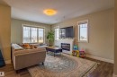 5704 Hawthorn Common, Edmonton, AB  - Indoor Photo Showing Living Room With Fireplace 