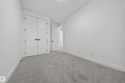 Unfurnished bedroom with carpet flooring and a closet - 