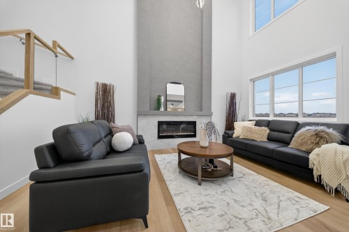 208 Crystal Creek Drive, Leduc, AB - Indoor Photo Showing Living Room With Fireplace