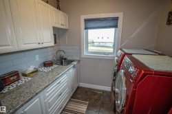Laundry area with cabinet space and washing machine and clothes dryer - 