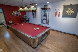 Game room with billiards table, a drop ceiling, light wood-type flooring, and recessed lighting - 