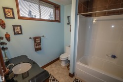 Full bathroom featuring vanity and shower / tub combination - 