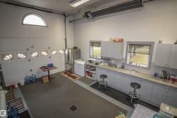 Garage featuring fridge and freestanding refrigerator - 