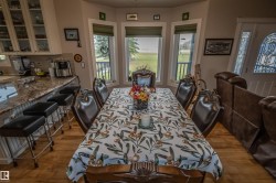 Dining room featuring light wood finished floors - 