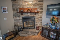 Detailed view of wood finished floors and a fireplace - 