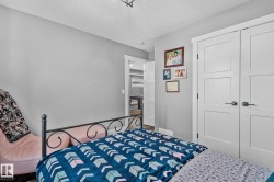 Bedroom with a closet and a textured ceiling - 