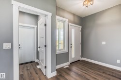 Entryway with dark wood-style flooring - 
