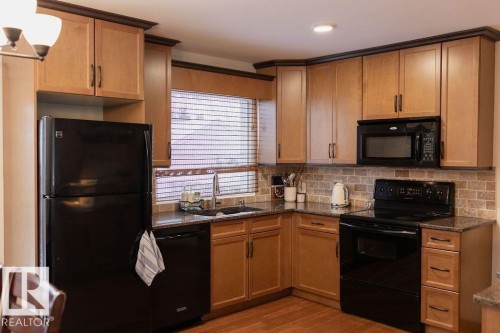 7211 83 Street, Edmonton, AB - Indoor Photo Showing Kitchen With Double Sink