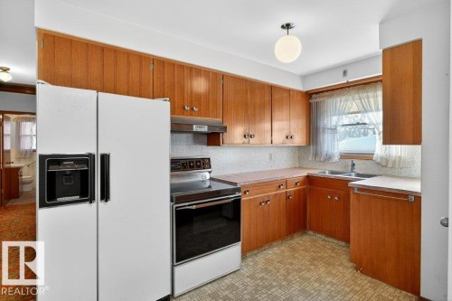12224 55 Street Nw, Edmonton, AB - Indoor Photo Showing Kitchen With Double Sink