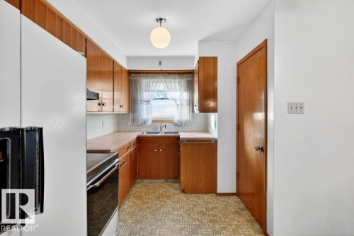 12224 55 Street Nw, Edmonton, AB - Indoor Photo Showing Kitchen With Double Sink