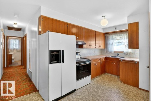 12224 55 Street Nw, Edmonton, AB - Indoor Photo Showing Kitchen With Double Sink