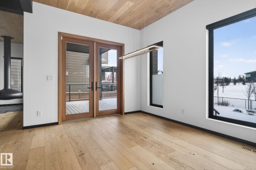 Unfurnished room featuring french doors, wood ceiling, and light wood finished floors - 104 Edgewater Circle, Leduc, AB - Indoor Photo Showing Other Room