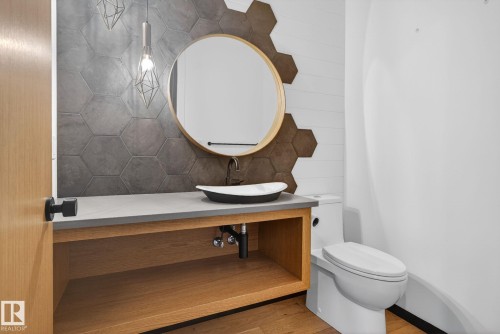 Bathroom featuring vanity and wood finished floors - 104 Edgewater Circle, Leduc, AB - Indoor Photo Showing Bathroom