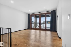 Unfurnished room with light wood finished floors and a water view - 