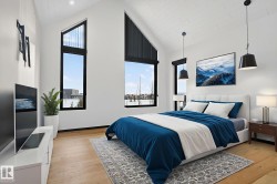 Bedroom featuring light wood-style floors and high vaulted ceiling - 