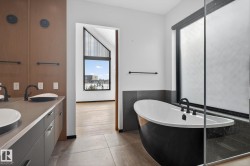 Bathroom with a freestanding tub and double vanity - 