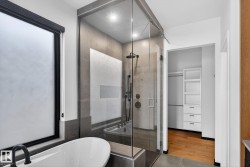 Full bathroom with a soaking tub and a shower stall - 
