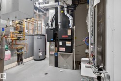 Utility room with water heater and heating unit - 