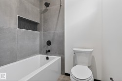 Bathroom with bathtub / shower combination and toilet - 