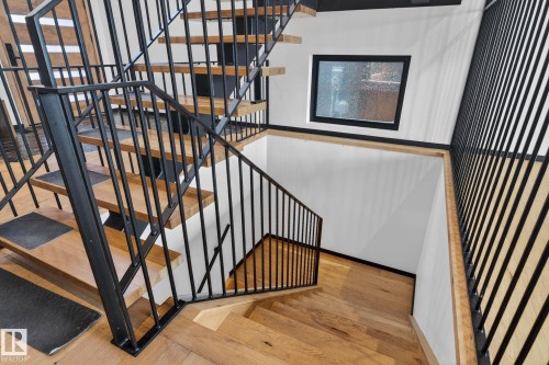 Stairs with wood finished floors - 104 Edgewater Circle, Leduc, AB - Indoor Photo Showing Other Room